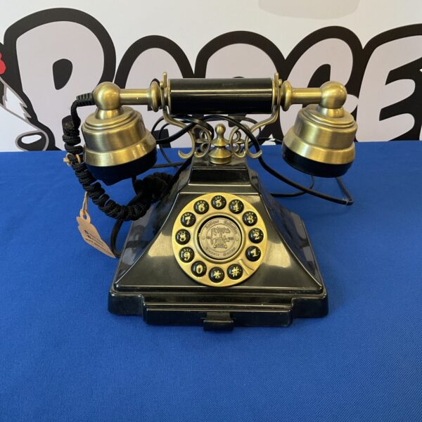 Front view of a black GPO retro Duke telephone with a cream dial.