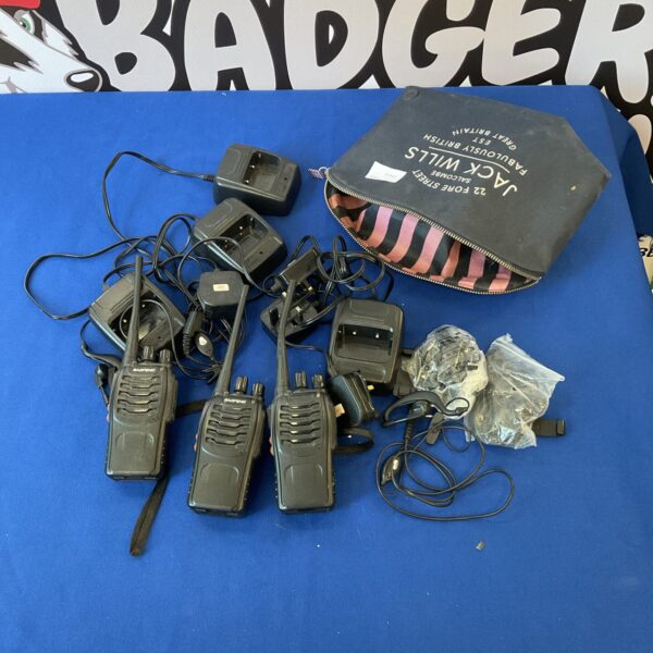 Black personal radios and chargers in a lot for collectors.