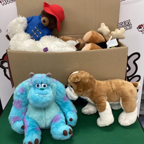 Assorted teddy bear lot with Paddington and Monsters Inc plush.