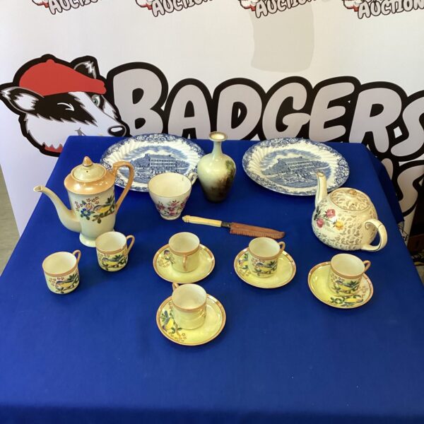 Vintage china collection featuring teapot and decorative plates.
