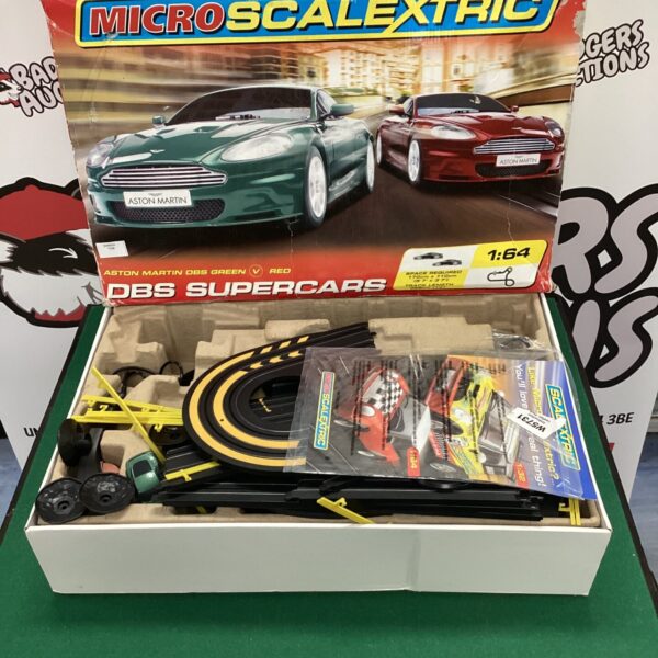 Micro Scalextric Aston Martin DBS model car in box.