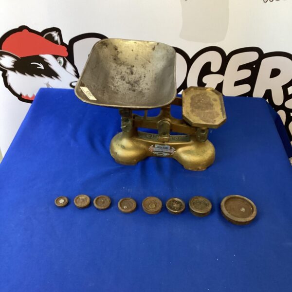 Antique J & J Gibbons brass balance scales with weights.