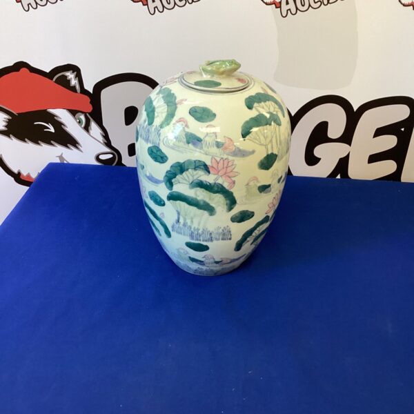 Vintage Chinese porcelain ginger jar with detailed hand-painted design.