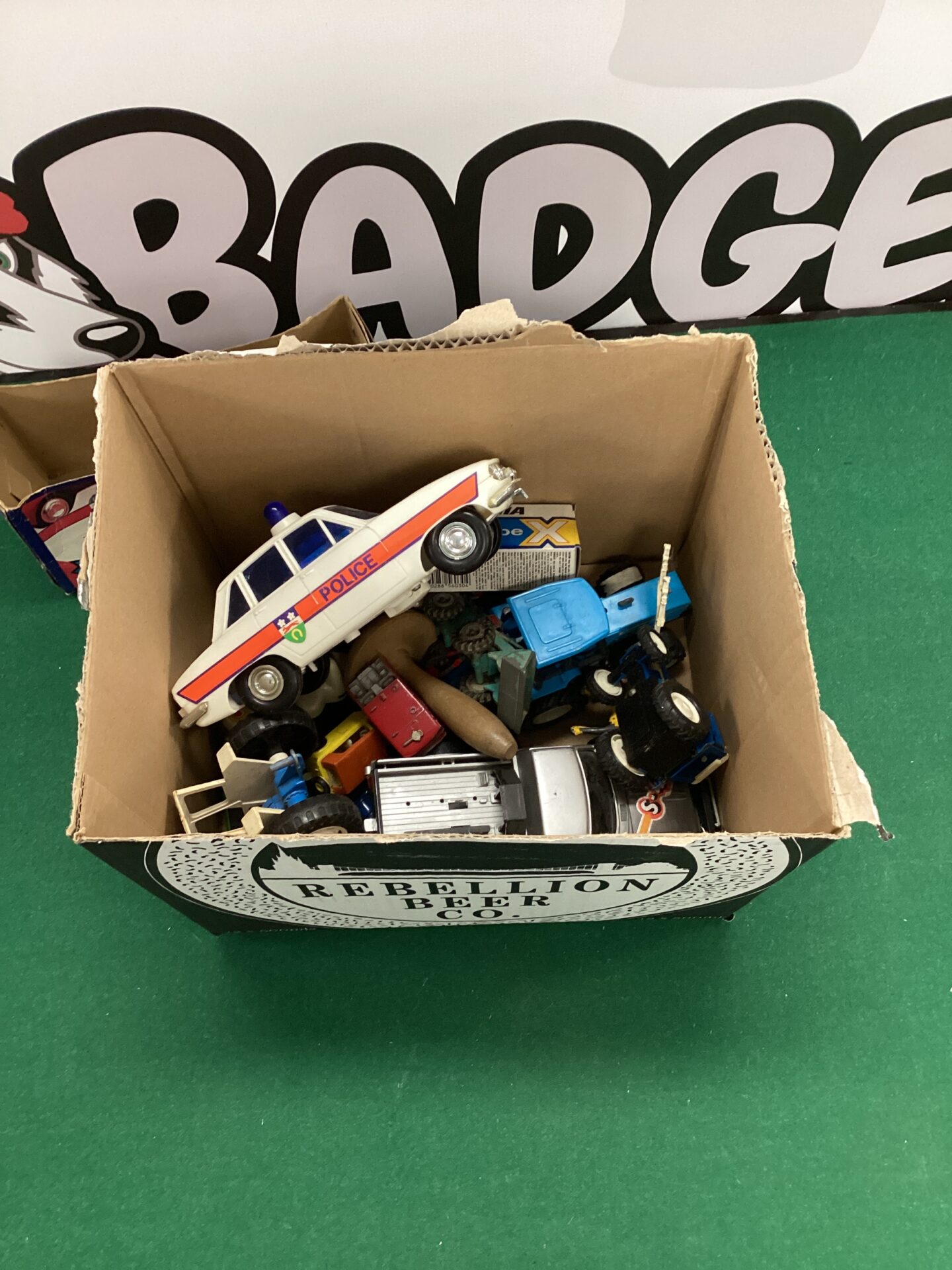 345 Box of assorted toy cars incl. tomy police car