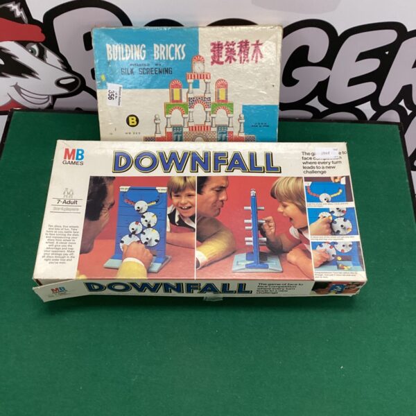 Vintage MB Games Downfall board game with silk screening building bricks.