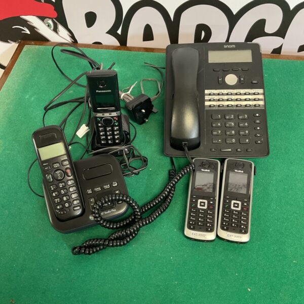 Collection of vintage and cordless home telephones, including Panasonic.