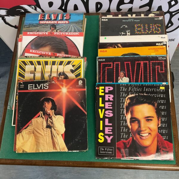 Lot of vintage Elvis Presley vinyl records for collectors.