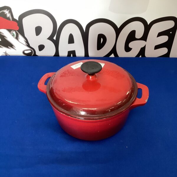 Large red cast iron casserole pot with lid.