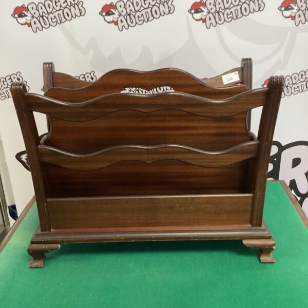 Vintage mahogany magazine rack for storing periodicals.
