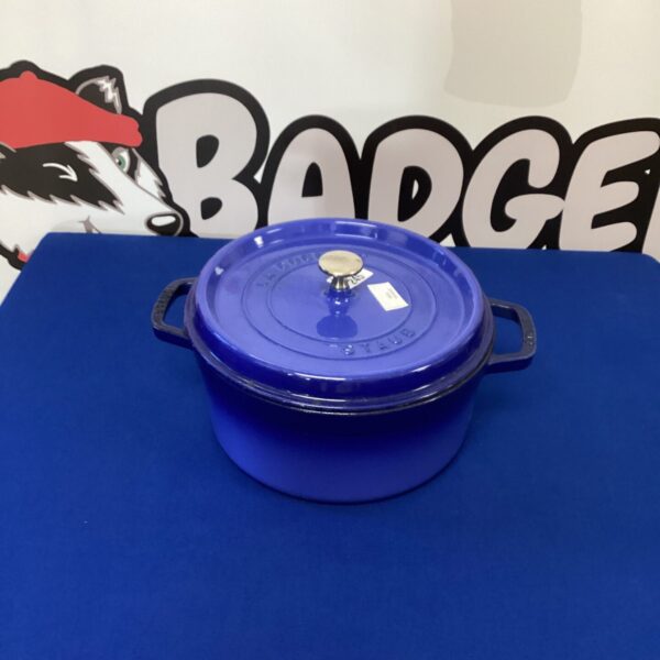 Blue enameled Staub cocotte casserole dish with lid.