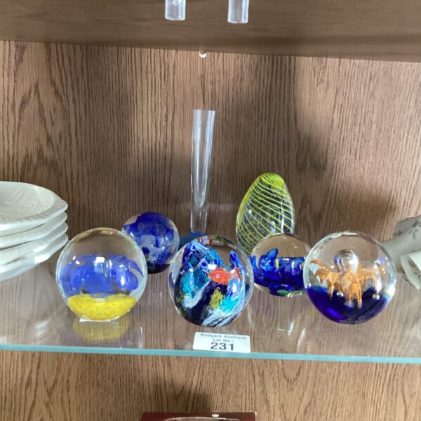 Vibrant Murano glass paperweights and posy vase collection.