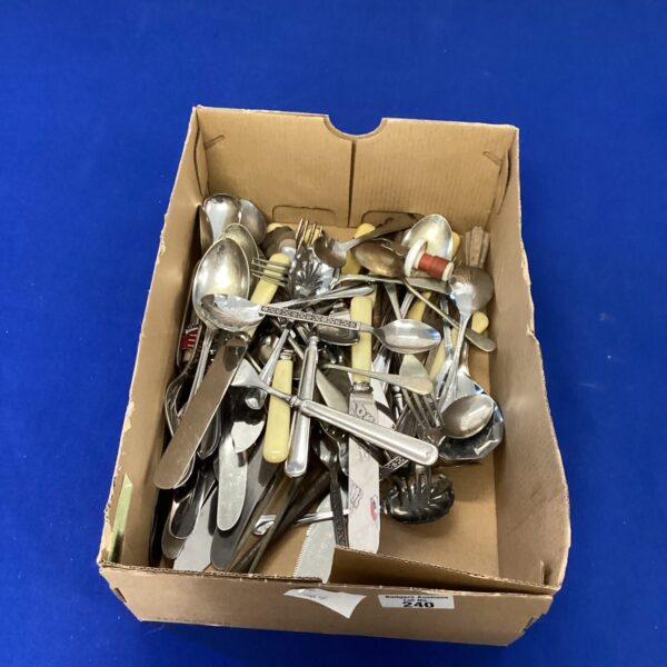 Mixed cutlery lot with stainless steel and silver plated forks, knives and spoons.