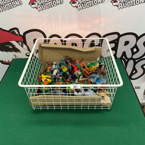 Assorted action figure lot featuring Teenage Mutant Ninja Turtles and Power Rangers.