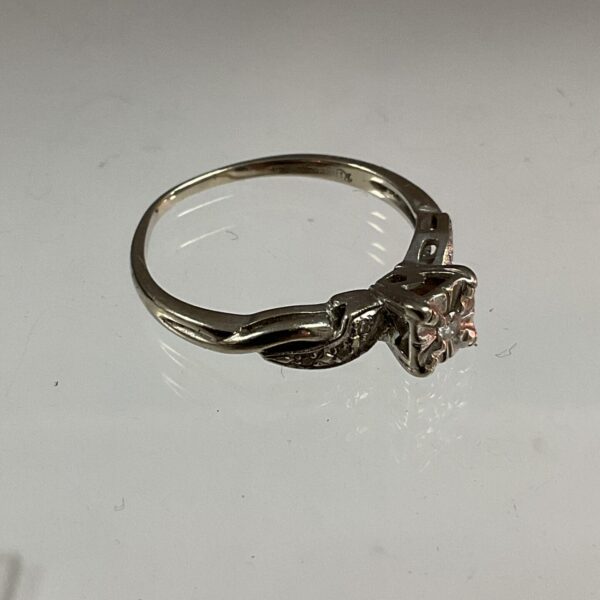 Sparkling diamond set in a 14k white gold ring.