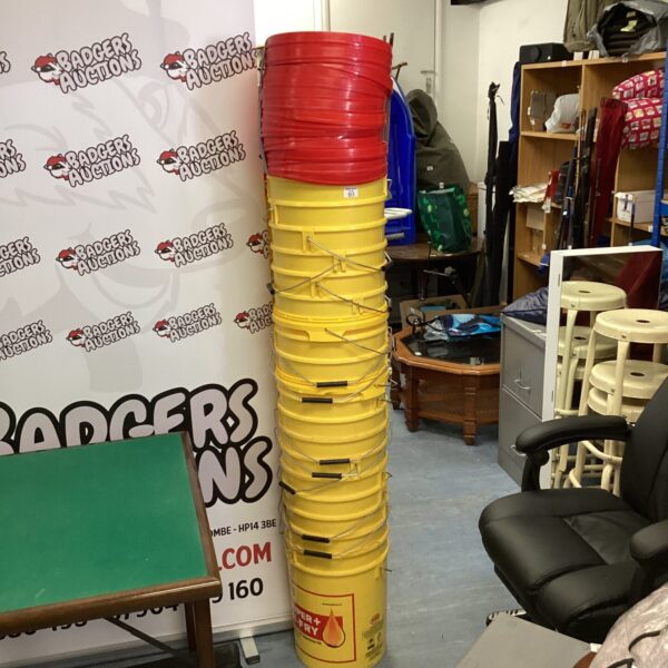 Stack of yellow Hi-Fry buckets for storage and industrial use.