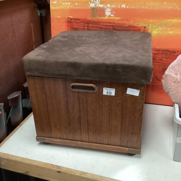 Vintage suede ottoman, a small footstool for home decor.