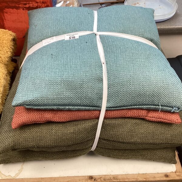 Four patterned Dunelm cushions, floral design, soft furnishings.