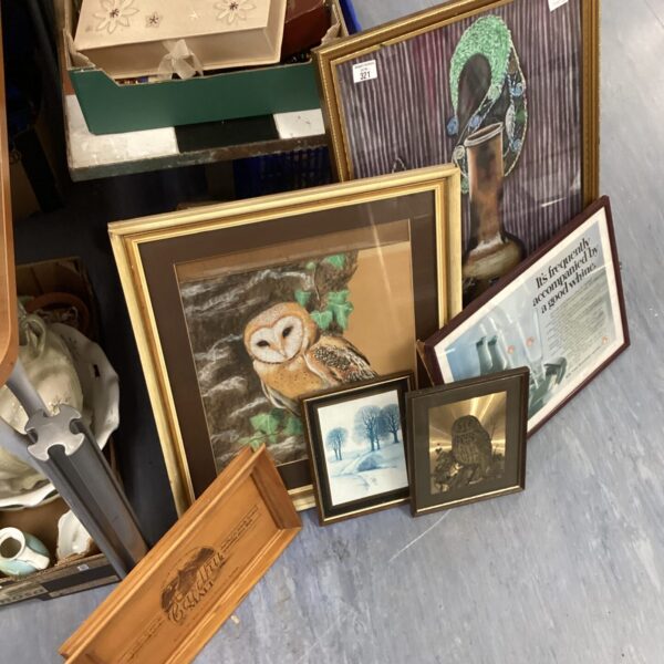Lot of framed owl prints and winter landscape artwork.