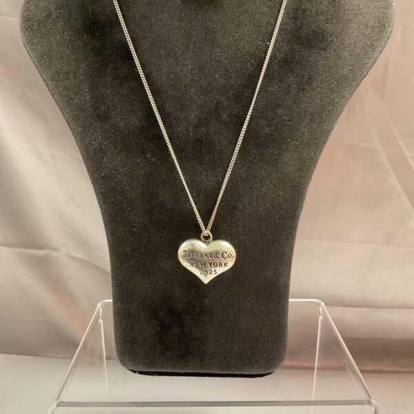 Silver Elsa Peretti Tiffany necklace pendant on chain.