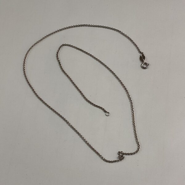 Delicate silver chain necklace, 18 inches long, simple design.