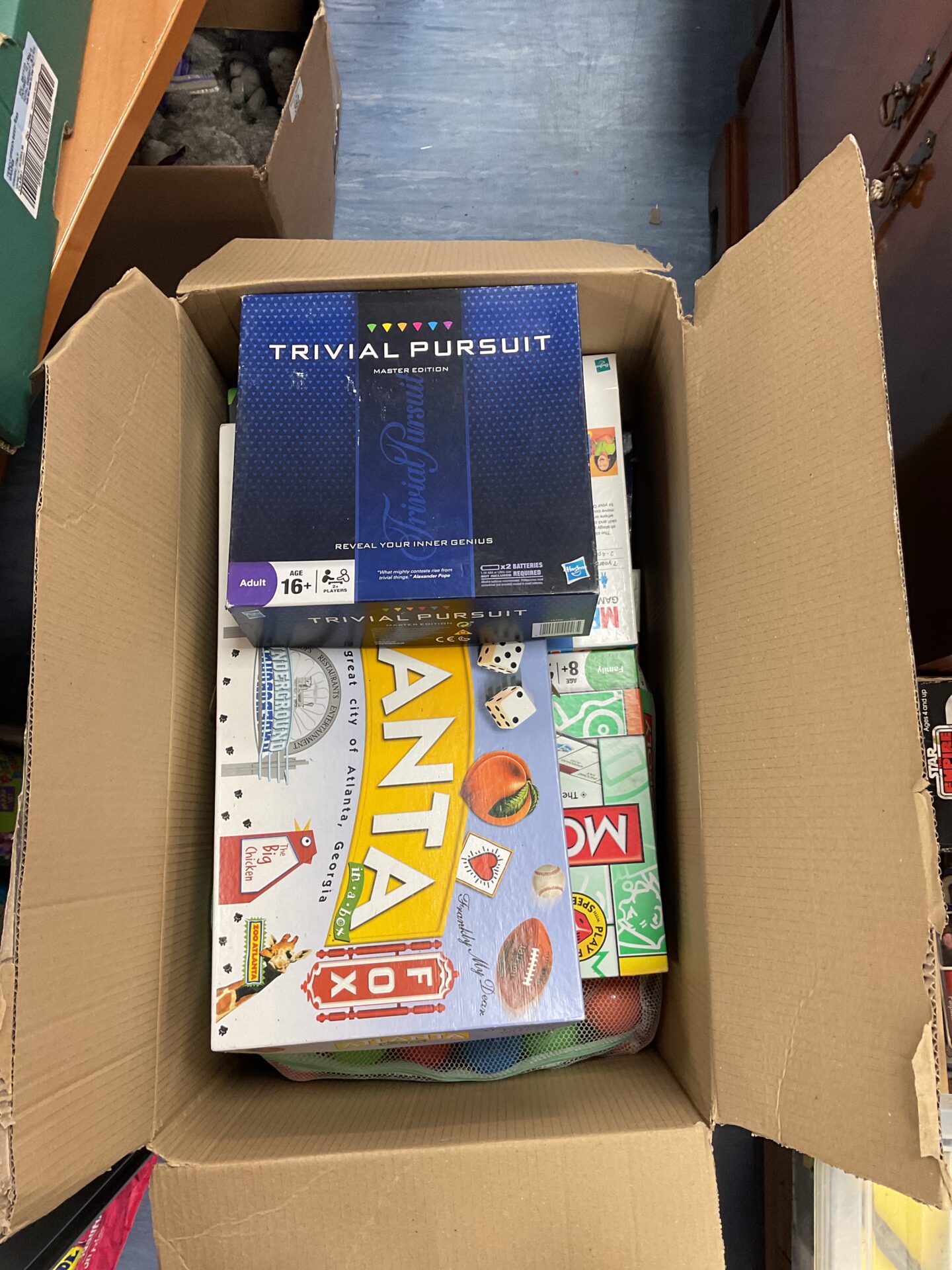 381 Large box of assorted board games incl. trivial pursuit, monopoly, atlanta