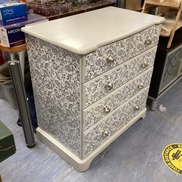 Vintage wooden chest of drawers with two over three drawer configuration.