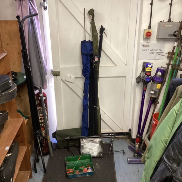 Overview of a fishing rods and tackle lot with various angling equipment.