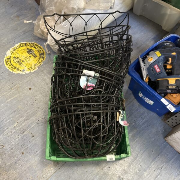 Large lot of used plastic hanging baskets for garden plants.