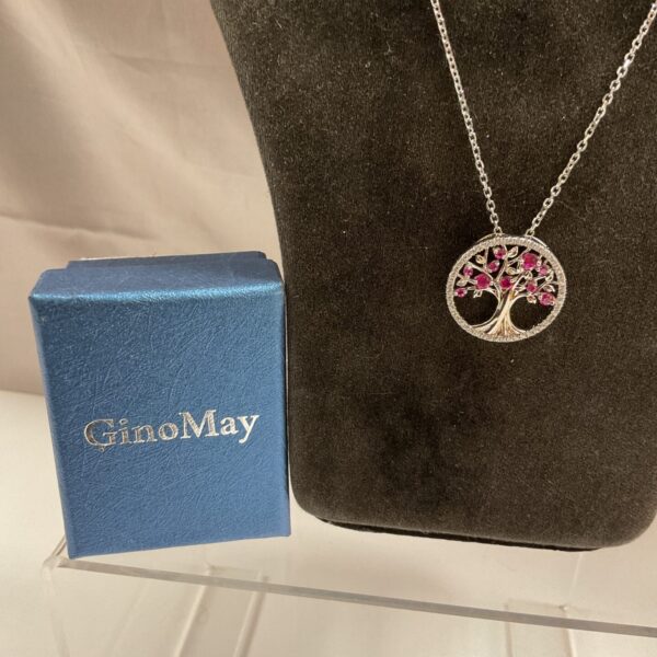Gino May Tree of Life necklace with red cubic zirconia stones.