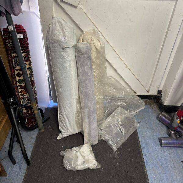 Rolled up large gazebo ready for outdoor use.