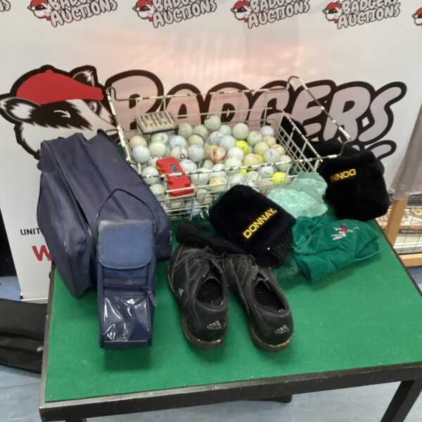 Mixed lot of golf balls, shoes, and a golf glove for sale.