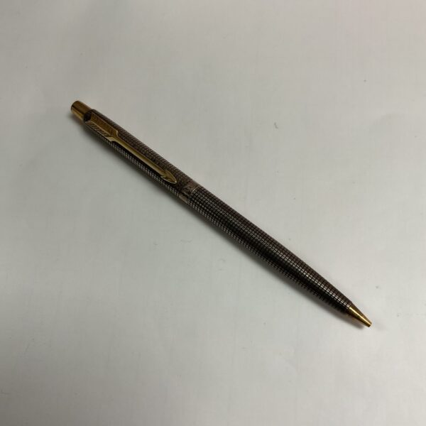 Vintage sterling silver Parker ballpoint pen with geometric pattern.
