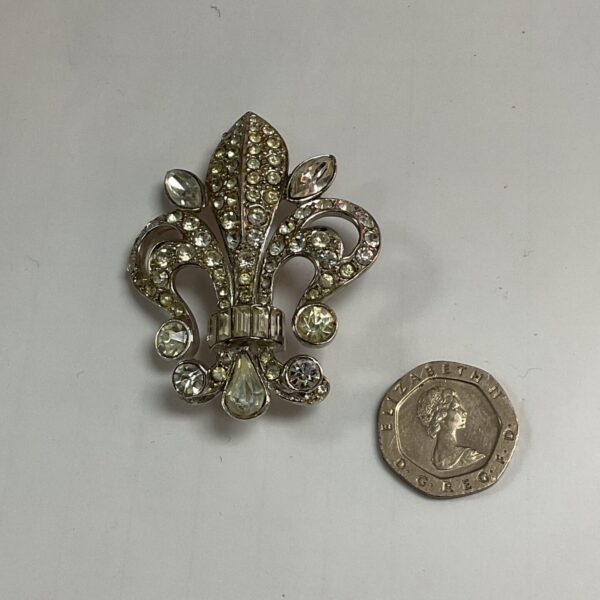 Sparkling antique diamonte Fleur De Lys brooch, vintage jewellery.