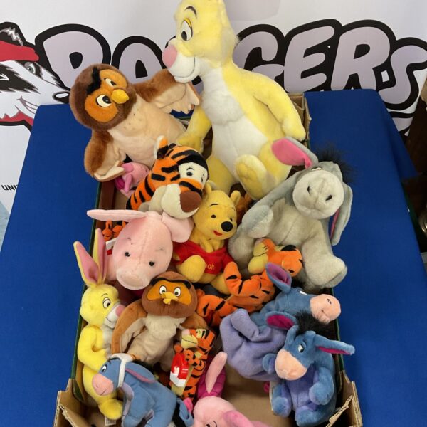 Winnie the Pooh soft toy collection featuring Disney and McDonald's characters.