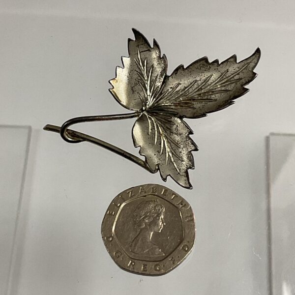 Detailed Scottish silver leaf brooch with hallmarking.