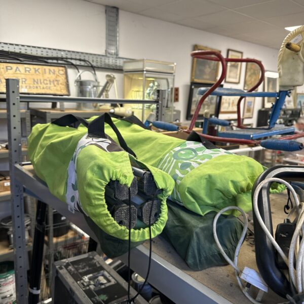 Lot of four vibrant green and blue folding camping chairs.