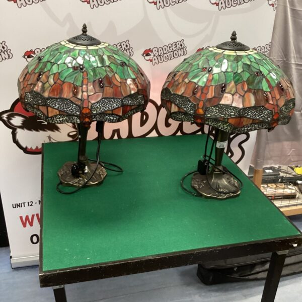 Two vintage Tiffany style table lamps with floral stained glass shades.