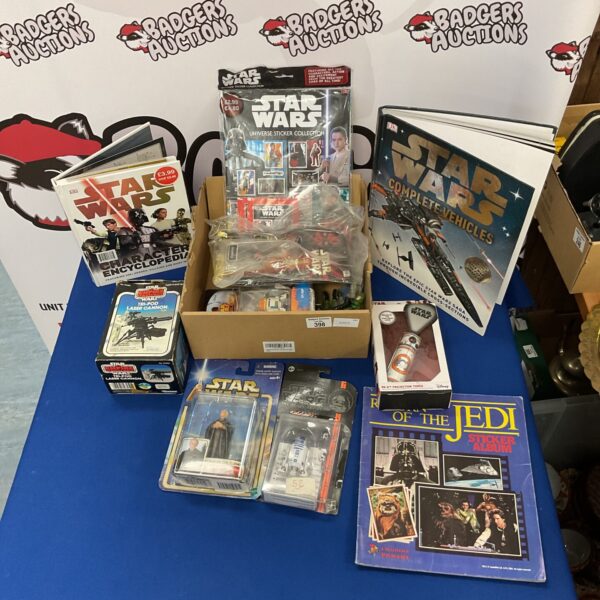 Vintage Star Wars magazine and sticker collection for collectors.