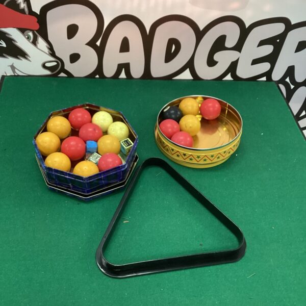 Vintage pool ball set in clear plastic case.