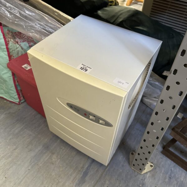 Vintage Amcor TC100 dehumidifier for moisture removal.