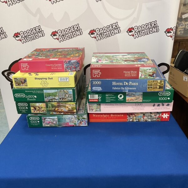 Assorted jigsaw puzzles lot including Falcon Deluxe and Corner Piece.
