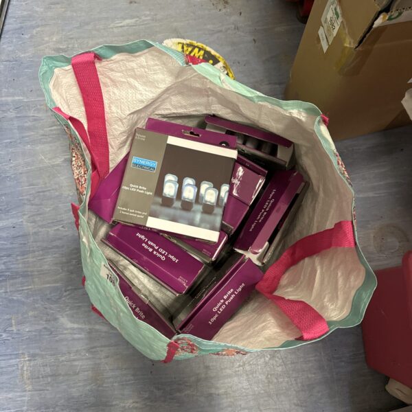 Lot of new Quick Brite LED push light bulbs in packaging.