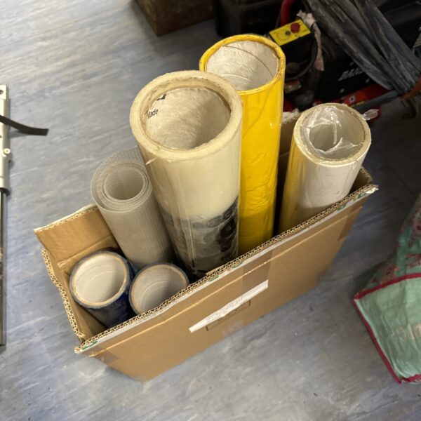 Assorted rolls of floor protector for construction and renovation projects.