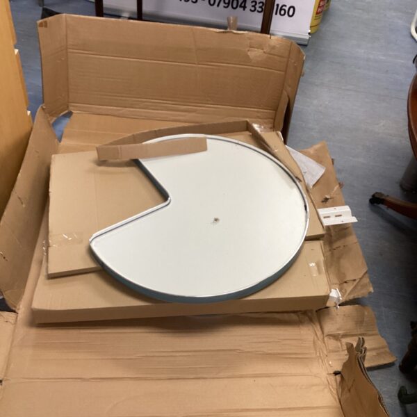 Kitchen carousel unit kit, partially disassembled in cardboard box.