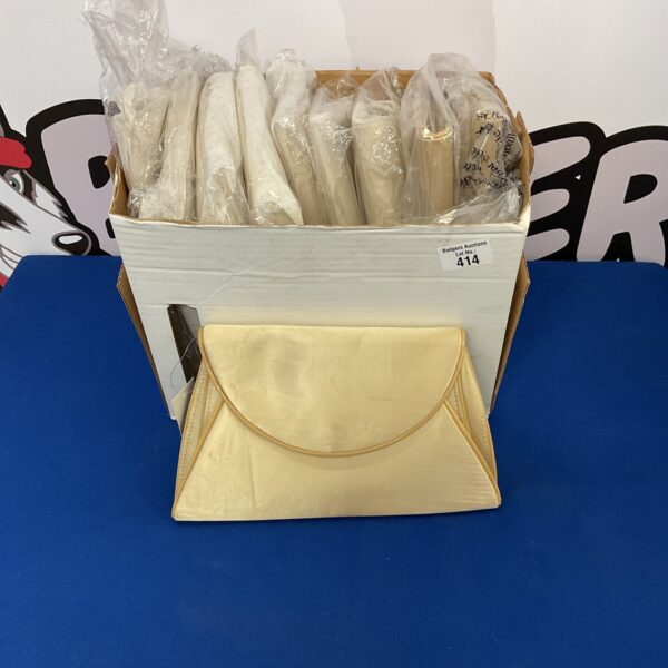 New lot of ladies’ gold tone purses in packaging.