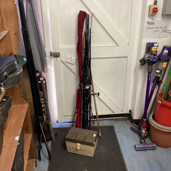 Collection of fishing rods and tackle box for angling.