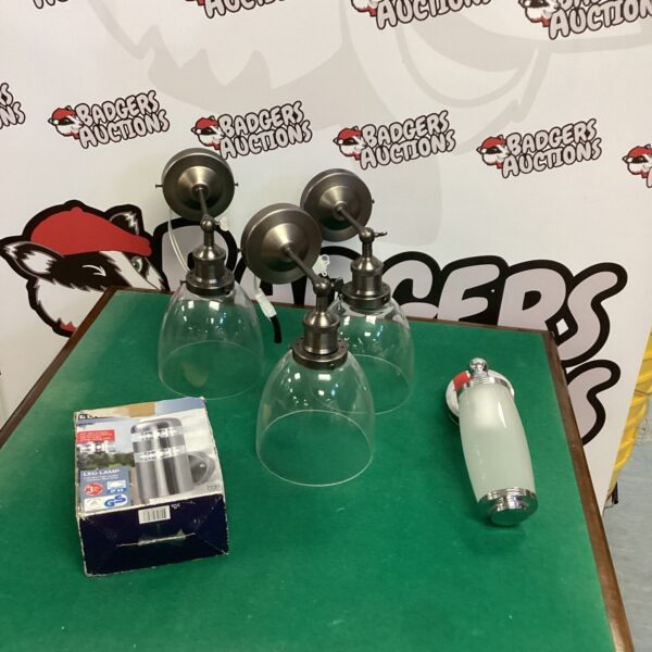 Vintage wall sconces set with frosted glass shades.