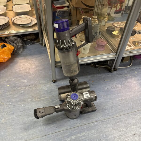 Two Dyson DC16 handheld hoovers in used condition.
