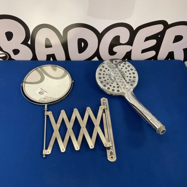 Chrome extendable shower head with telescopic design for bathroom use.