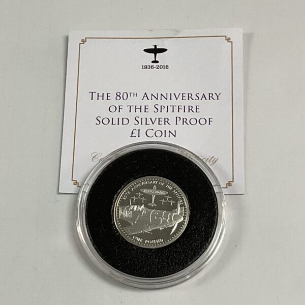 Silver Spitfire £1 coin in protective capsule.